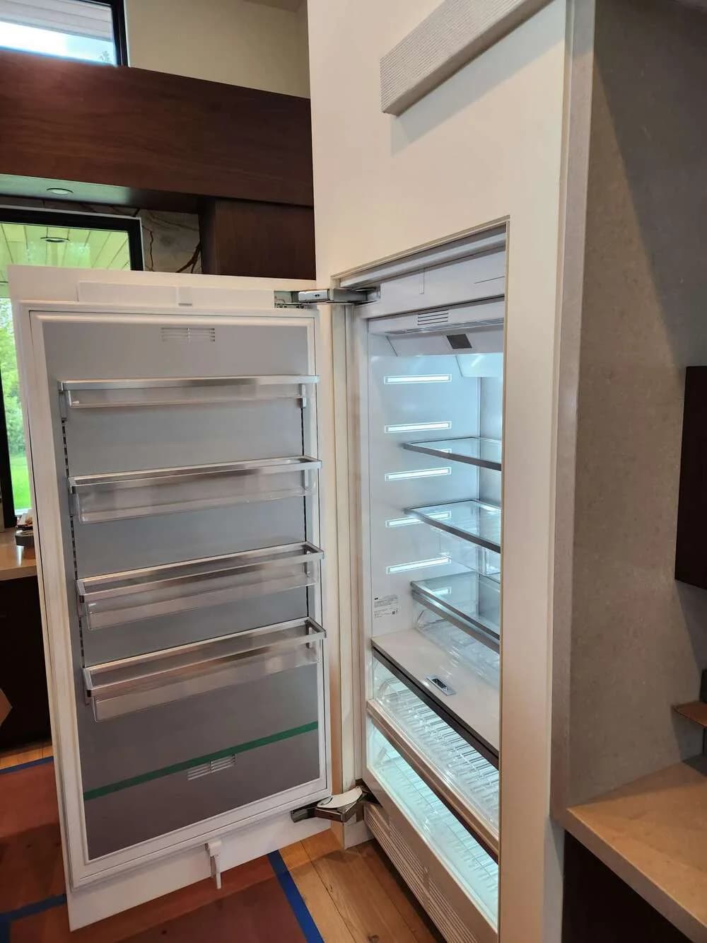 Commercial cooler interior emptied and sanitized shelf by shelf