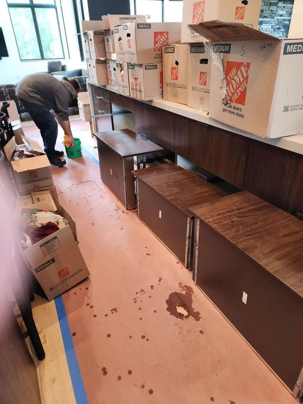 Restaurant kitchen mid-service-clean, equipment staged for degreasing
