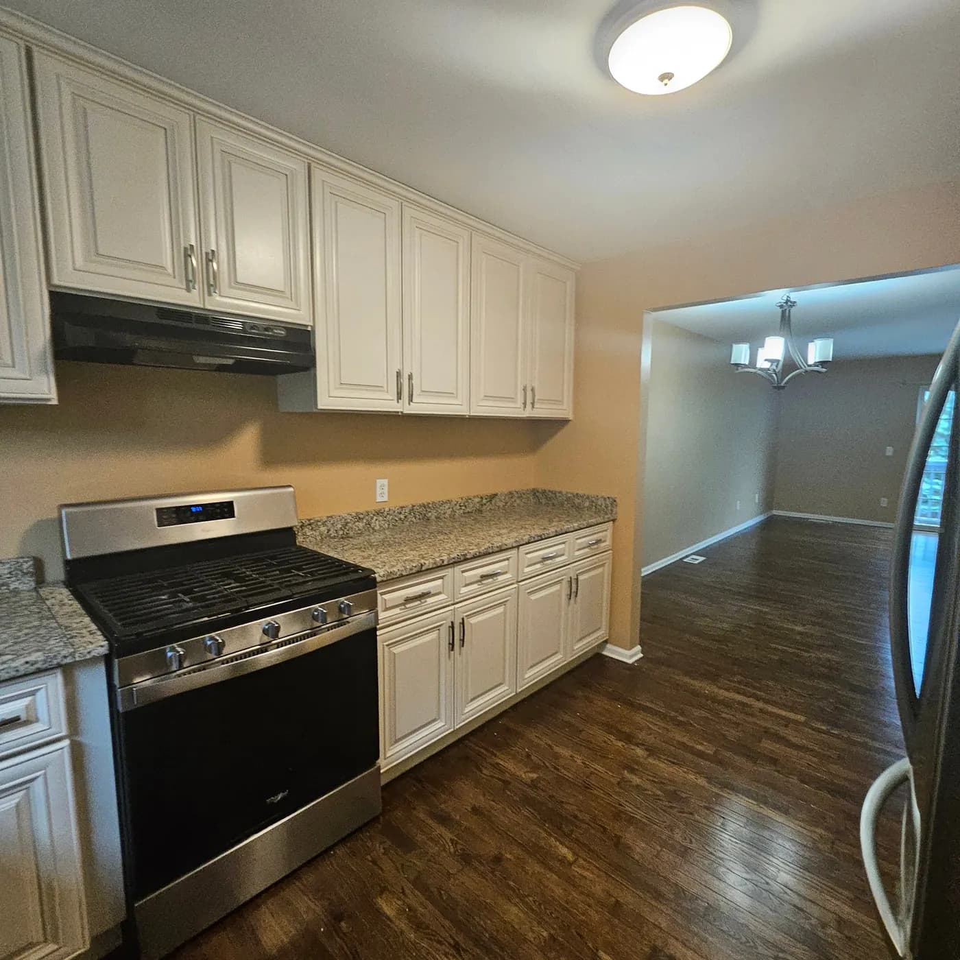 Kitchen with cream cabinets from the SWAT residential cleaning portfolio